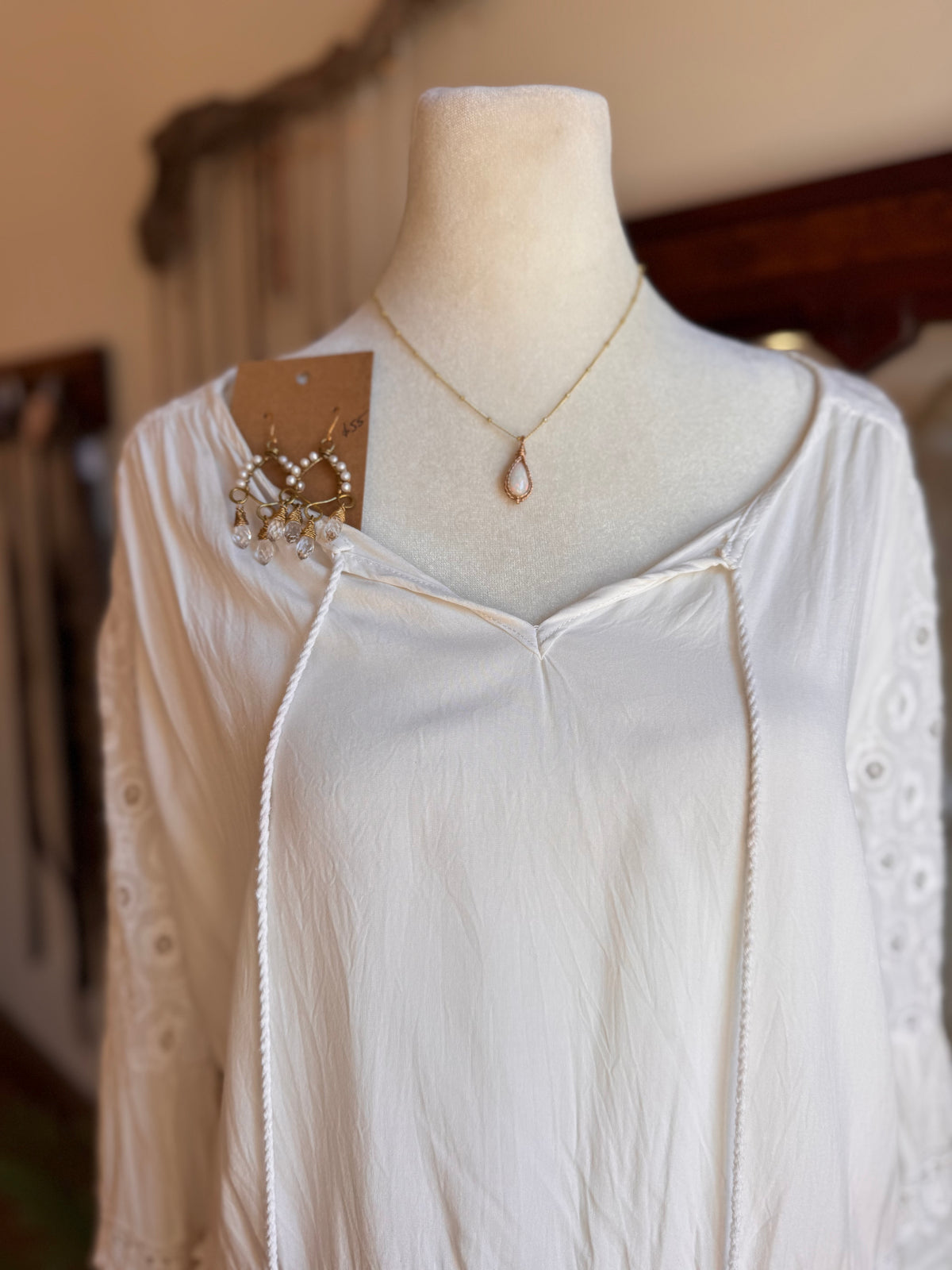 Size M embroidered bell sleeve top