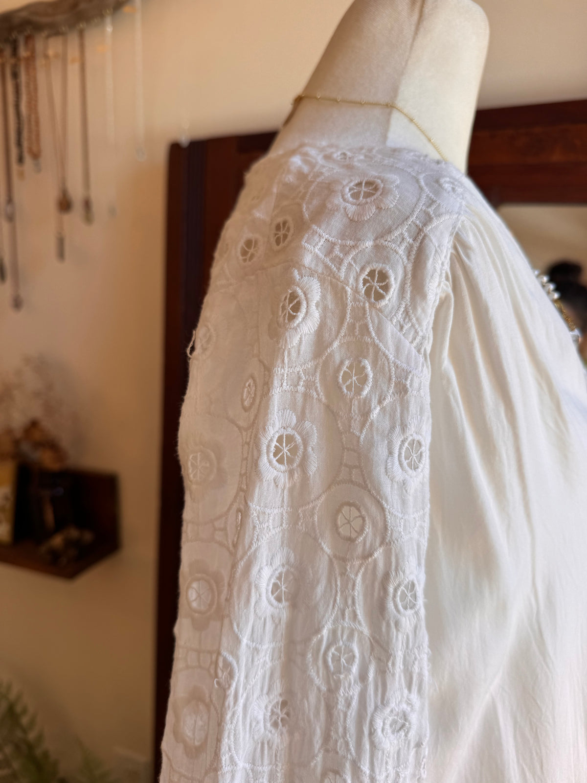Size M embroidered bell sleeve top