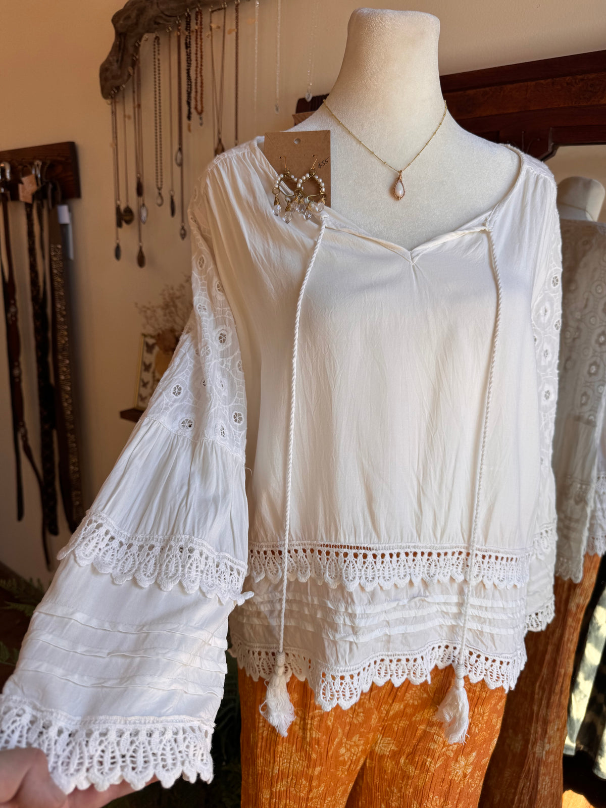 Size M embroidered bell sleeve top