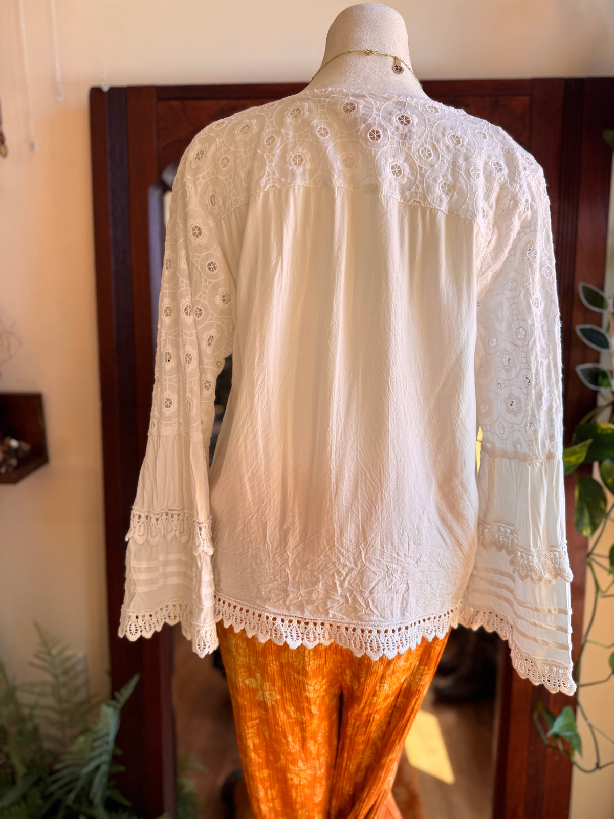 Size M embroidered bell sleeve top